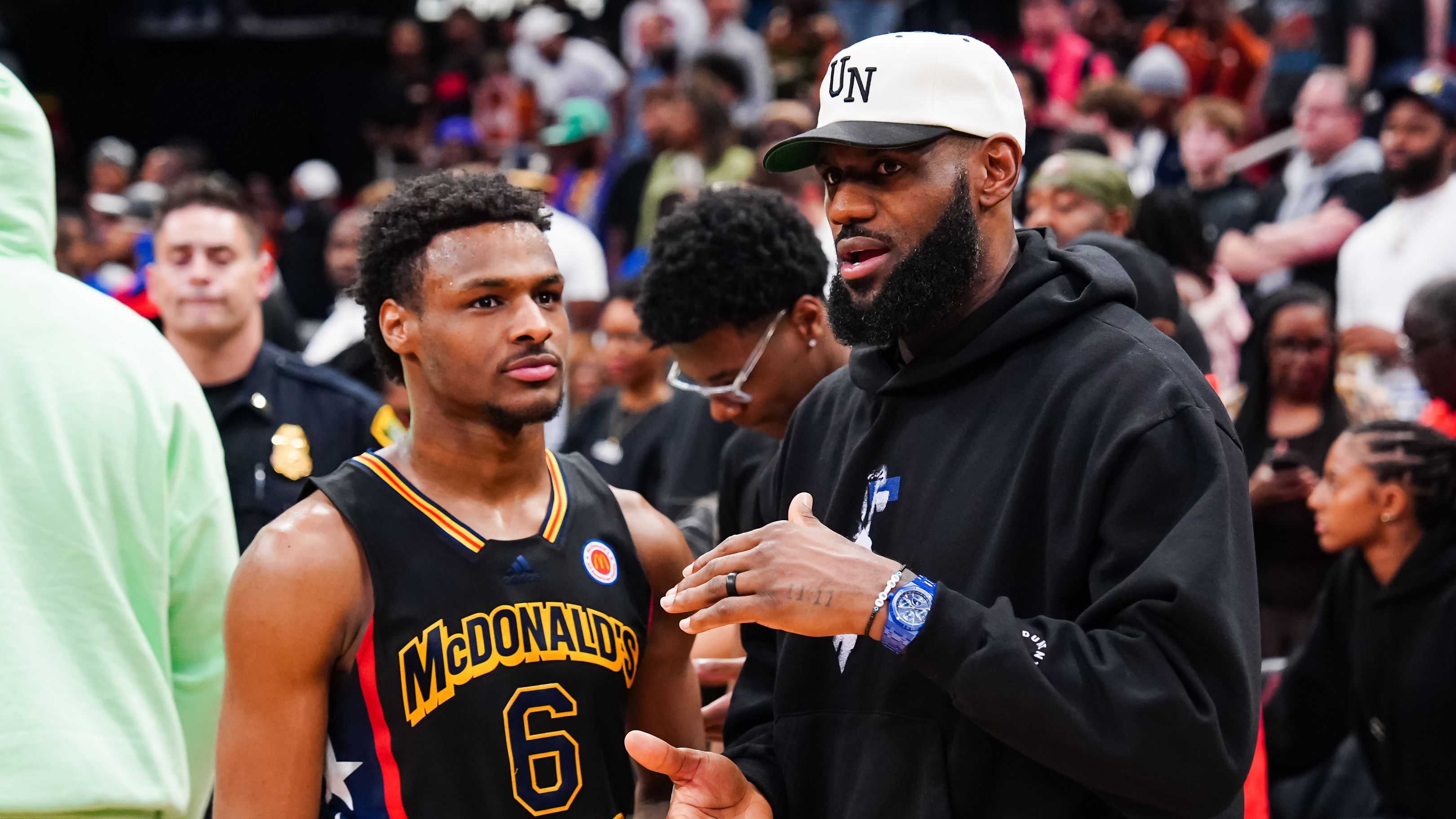 HOUSTON, TEXAS - MARCH 28: Bronny James #6 of the West team talks to Lebron James of the Los Angeles Lakers after the 2023 McDonald&#x27;s High School Boys All-American Game at Toyota Center on March 28, 2023 in Houston, Texas. (Photo by Alex Bierens de Haan/Getty Images)