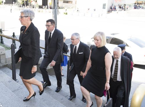 Victorian Governor Linda Dessau (left) and Victorian Premier Daniel Andrews (second left) arrive for the state funeral service for Ron Walker. (AAP)