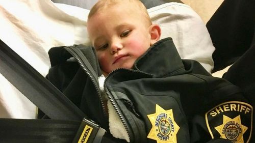 One-year-old Bradley Thomas was found naked by police, who wrapped him in a jacket.