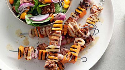 Maple-glazed chicken and kumara skewers with spinach pecan salad