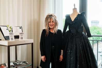 Elizabeth Emanuel with Princess Diana's black 'sister dress' at Julien's Auctions Princess Diana's Style & A Royal Collection preview at the Peninsula Residences London held June 3, 2025.