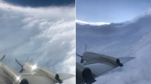 Photograph captures the wing and propeller of a US Air Force plane flying in and around Hurricane Dorian. The 'stadium effect' is evident.