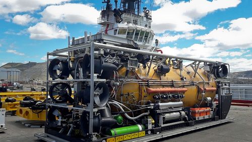 A US Navy pressurized rescue module sits on the dock before being loaded on a search ship. (Photo: AP).