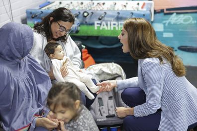 Kate, Princess of Wales, meets a mother and baby  during a visit to the Windsor Family Hub on Tuesday, June 6, 2023 in Windsor, England 