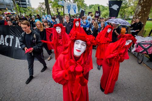 The XR Red Rebel Brigade will appear at demonstrations across the world in protests expected to bring everyday business to a stand still.