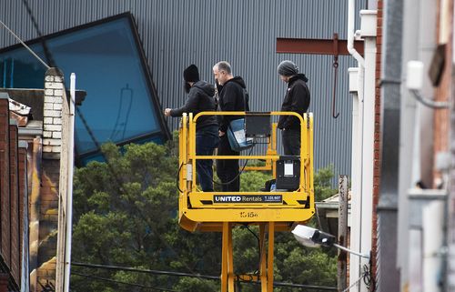 Spencer Tunick and his crew scope out the spot for this morning's nude shoot at Prahran. Picture: AAP