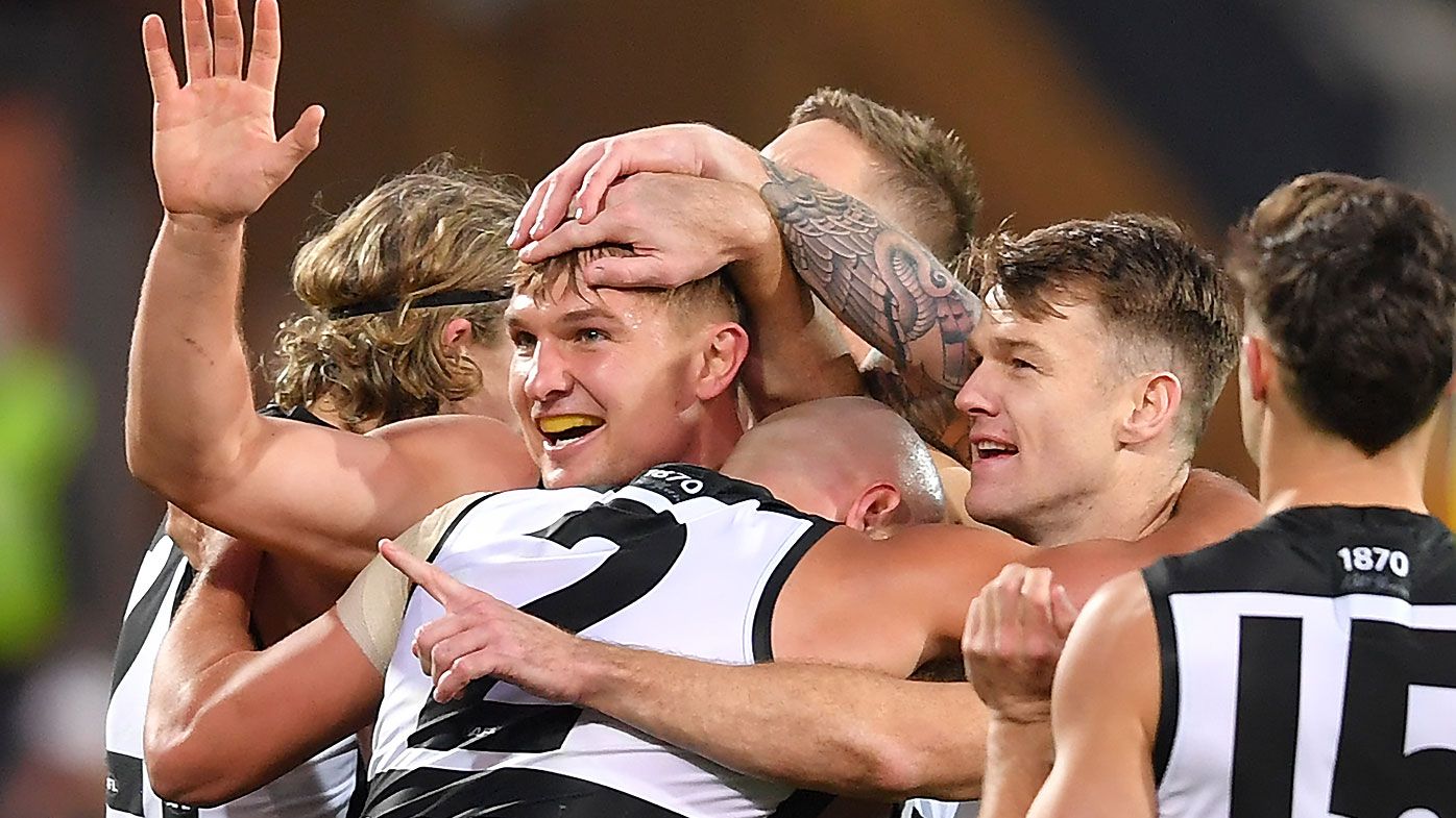 AFL fans stunned as Port Adelaide prevails over Richmond in 'game of the season'
