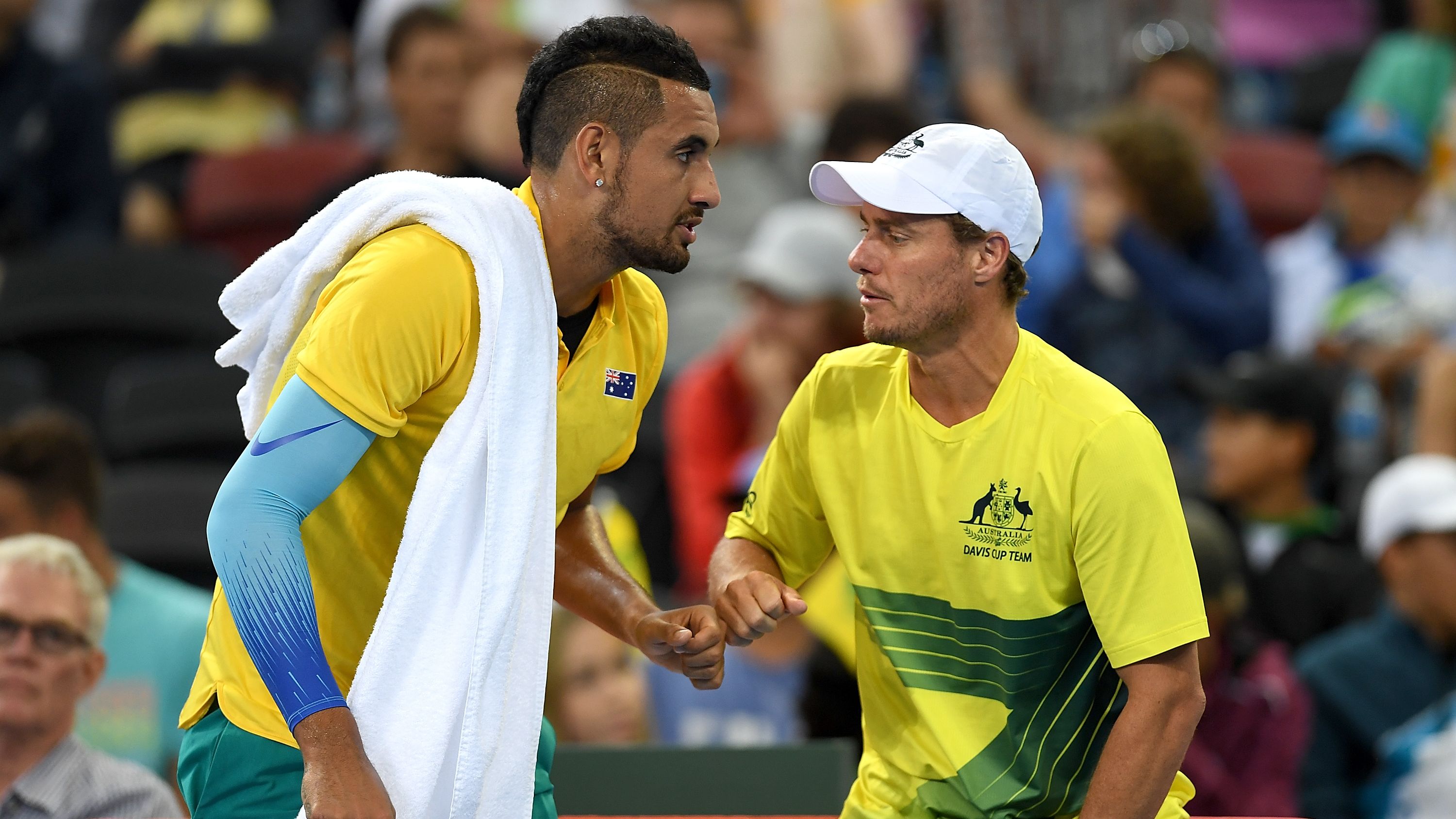 Australian team captain Lleyton Hewitt speaks to Nick Kyrgios during his singles match during the Davis Cup World Group First Round tie.