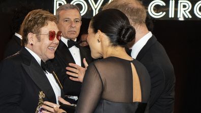 The Duke and Duchess of Sussex speak with Elton John at The Lion King premiere in London in 2019.