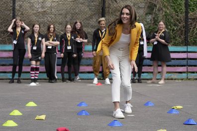 Britain's Kate, the Princess of Wales, plays as she visits the Dame Kelly Holmes Trust and meets with some of the young people that the charity supports in Bath, England, Tuesday, May 16, 2023. The Dame Kelly Holmes Trust is a youth development charity founded on the belief that every young person needs a champion. The organisation puts world class athletes shoulder to shoulder with young people to pass on their winning mindset and provide coaching and mentoring, helping those who are facing adv