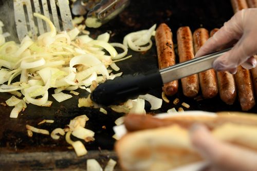 On top or underneath, the iconic democracy sausage will have grilled onions regardless.