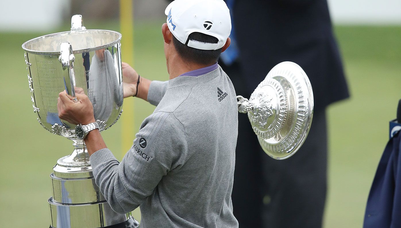 Collin Morikawa drops the top off the Wanamaker Trophy after winning the PGA Championship.