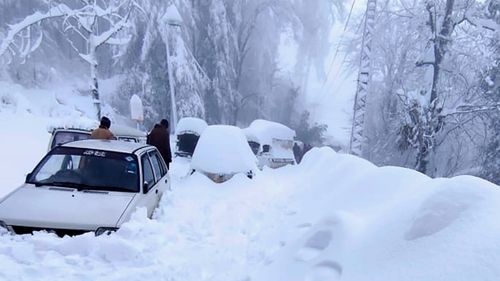 In this photo provided by the Inter Services Public Relations, army troops take part in a rescue operation in a heavy snowfall-hit area in Murree, 45 km north of the capital of Islamabad, Pakistan.