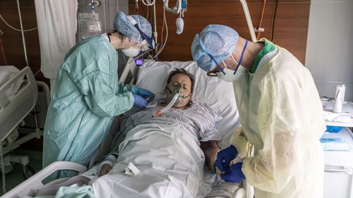 Nurses attend to a COVID-19 patient at the Pope John XXIII Hospital on April 7, 2020 in Bergamo, Italy.