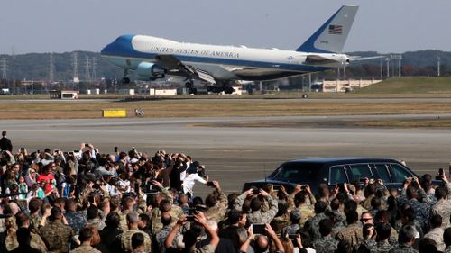 Crowds watched as US President Donald Trump touched down in Japan. (AAP)