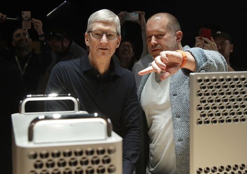 Apple CEO Tim Cook, left, and chief design officer Jonathan Ive look at the Mac Pro in the display room at the Apple Worldwide Developers Conference in San Jose, Calif., Monday, June 3, 2019