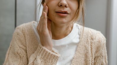 Stock image of a woman with a bruised face, domestic abuse.