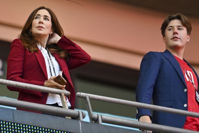 Mary, Crown Princess of Denmark, looks from the stands with her son Prince Christian ahead of the Euro 2020 soccer championship semifinal between England and Denmark at Wembley stadium in London, Wednesday, July 7, 2021. (Justin Tallis/Pool Photo via AP)