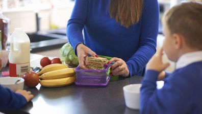 Woman packing lunchbox