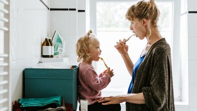 Photo series of a young mother with a child doing different chores at home. Shot in Berlin.