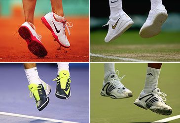 What surface do players compete on in the French Open?