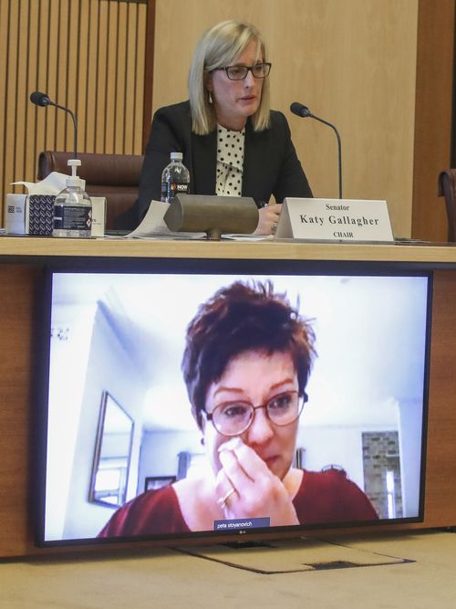 Senator Katy Gallagher  listens as Peta Stoyanovich-Kristie (appearing via video-conference) discusses repatriation and travel issues during a Senate hearing on COVID-19. Photo: Alex Ellinghausen