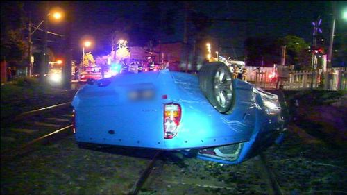 Teens crash car, flip onto tracks and collide with moving train in Ivanhoe