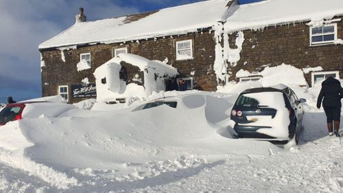 Dozens of people are trapped in a pub in England for the third night after heavy snowfall.