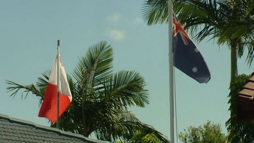 It is understood he raised the flag to protest the noise of his neighbours' Australian flag. (9NEWS)