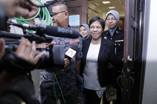 Maria Elvira Pinto Exposto leaves her hearing at the Shah Alam High Court after being found not guilty. (AAP)