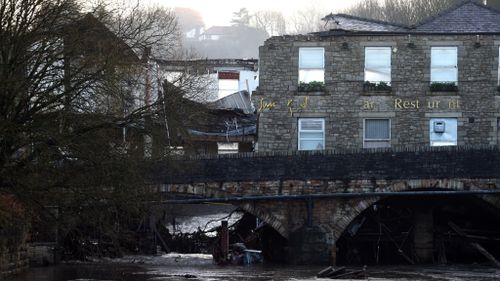 The historic Waterside Pub was damaged by floodwaters. (AFP)