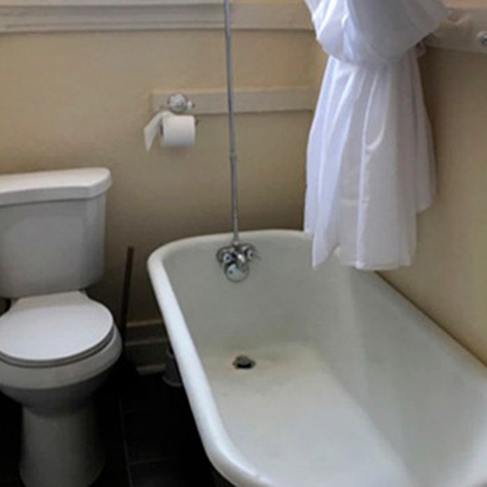 St. Louis apartment has a toilet and bathtub in the kitchen