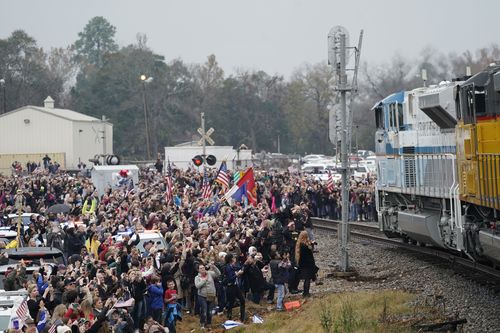 Crowds gathered to see special train 4141 pass through Texas carrying the body of the former US President.