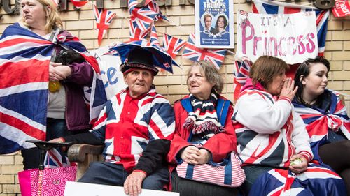 Spectators outside the hospital awaited the news of the newborn princess. (AAP)