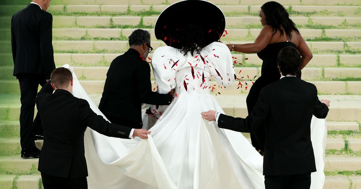 Four people forced to carry sports icon's wild Met Gala look