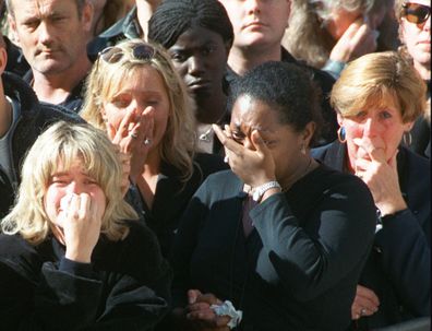 Spectators weep in the crowd along London's Whitehall Saturday September 6, 1997, during the funeral ceremony for Diana, Princess of Wales. 