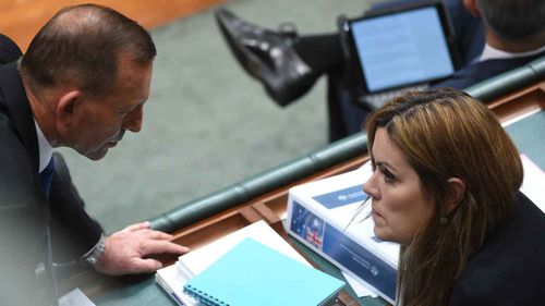 Tony Abbott speaks to Peta Credlin in 2015. (AAP)