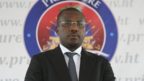 Interim Prime Minister Claude Joseph stands before delivering his speech during the appointment of Ariel Henry as the new Prime Minister in Port-au-Prince, Haiti on Tuesday, July 20 in 2021.
