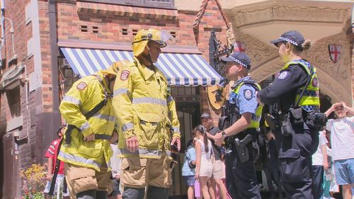 A man in his 20s has been rescued after hours stuck between two buildings in Perth's main shopping streets.