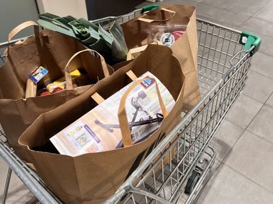 shopping bags at supermarket groceries coles woolworths aldi 