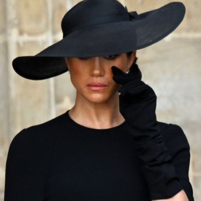 Meghan Markle, the Duchess of Sussex wipes a tear away as she attends The State Funeral of Her Majesty The Queen on 19 Sep 2022.