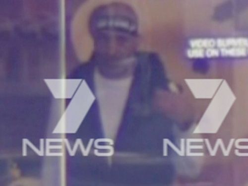 The man believed to be holding at least 13 people hostage inside the Lindt cafe. (Seven Network)