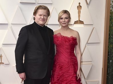 Jesse Plemons, left, and Kirsten Dunst arrives at the Oscars on Sunday, March 27, 2022, at the Dolby Theatre in Los Angeles. 