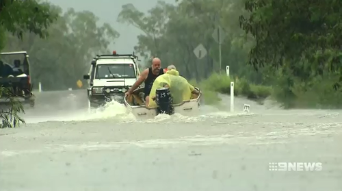 Roads have been cut off and many homes are affected by flood waters in Queensland's north.