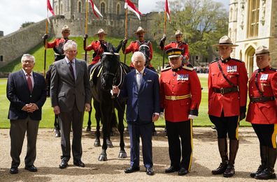 King Charles III (centre) alongside Ralph Goodale, the High Commissioner for Canada in the UK (left) and Royal Canadian Mounted Police (RCMP) Commissioner Mike Duheme (third right) after he was officially presented with 'Noble', a horse given to him by the RCMP earlier this year, as he formally accepted the role of Commissioner-in-Chief of the RCMP during a ceremony in the quadrangle at Windsor Castle on April 28, 2023 in Windsor