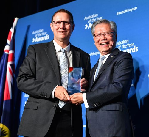 Dr Richard Harris is presented with his award by South Australian Governor Hieu Van Le at the 2019 South Australian of the year awards ceremony at Adelaide Oval.