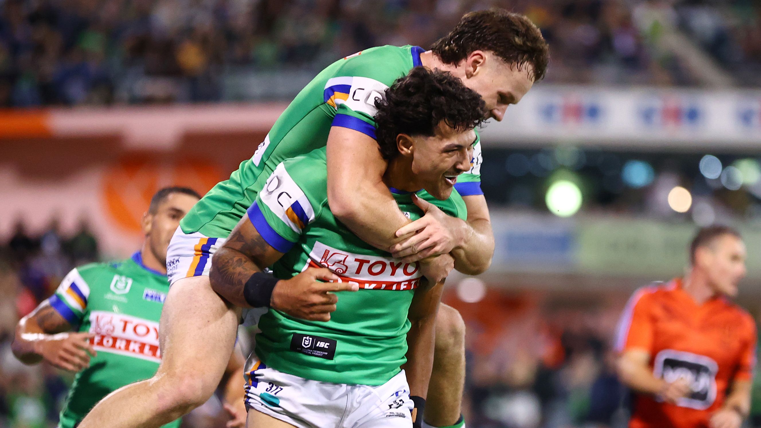 Xavier Savage celebrates scoring a try with teammates during the round five NRL match between the Canberra Raiders and the Parramatta Eels.