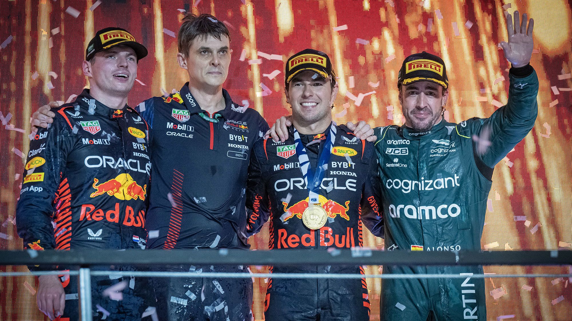 Race winner Sergio Perez, second placed Max Verstappen (L) and third placed Fernando Alonso (R) celebrate on track after the Saudi Arabia Grand Prix.