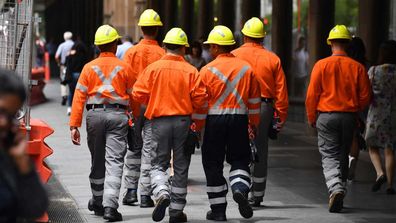 Tradies walking.