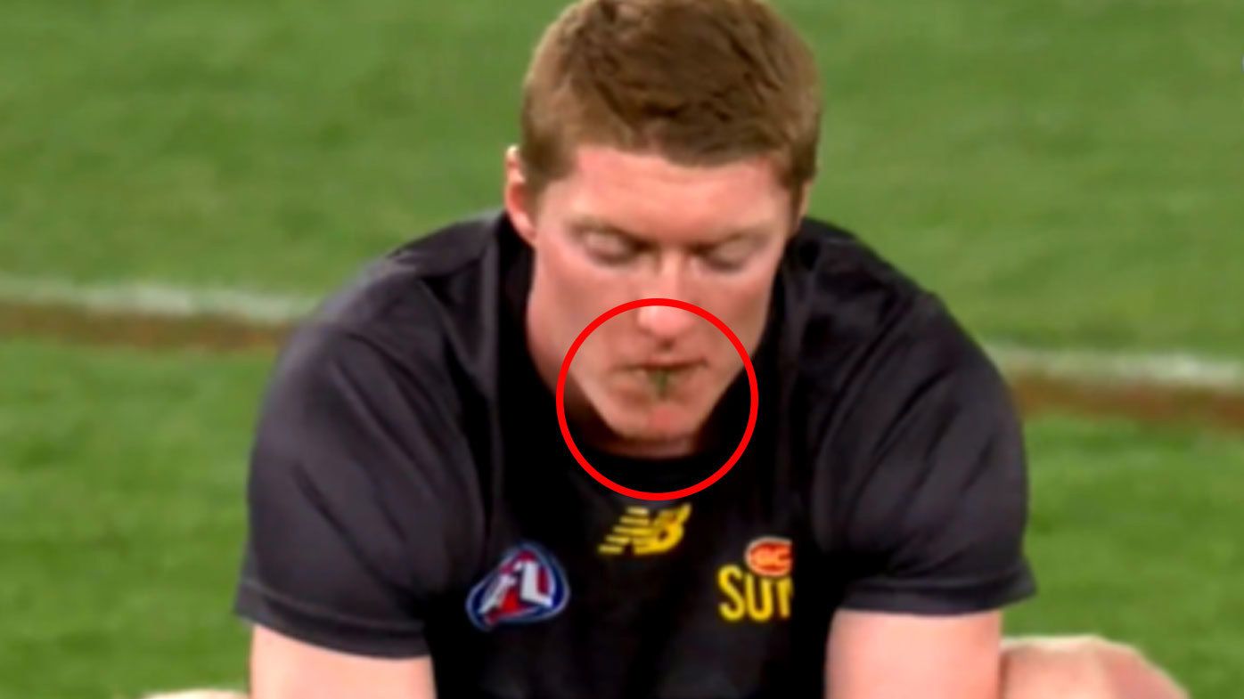 Cameras caught Suns star Matt Rowell in his weird pre-game ritual of eating grass from whichever stadium he plays at